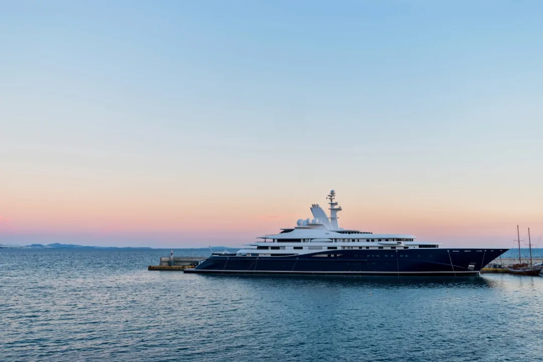 Yacht docked while the sunsets