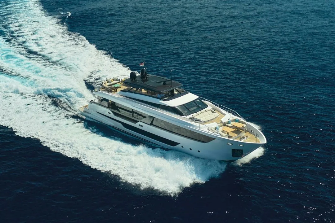 Aerial photo of yacht driving through water