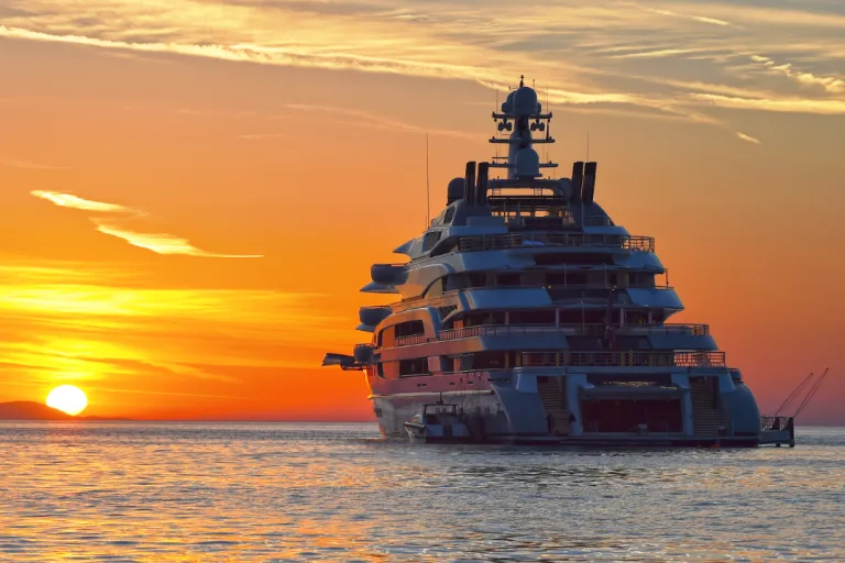 Yacht anchored with sunset in the background