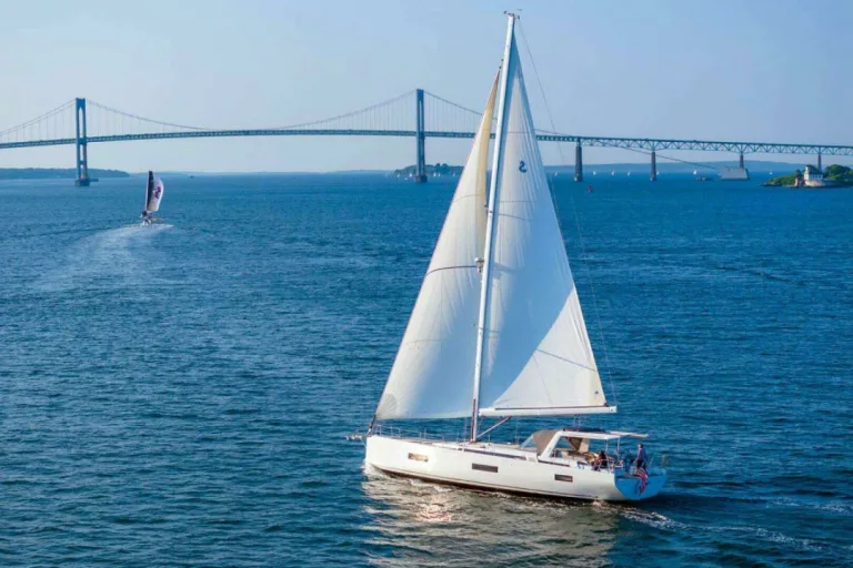Yacht driving with bridge in background