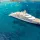 Superyacht anchors in crystal blue waters