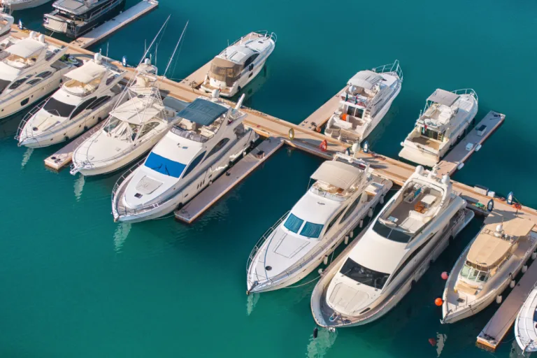 Yachts docked at a marina