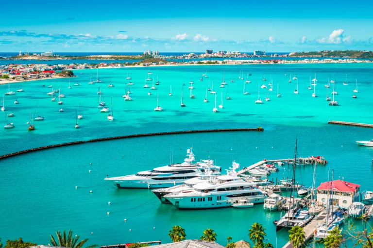 Crystal blue water marina with superyachts